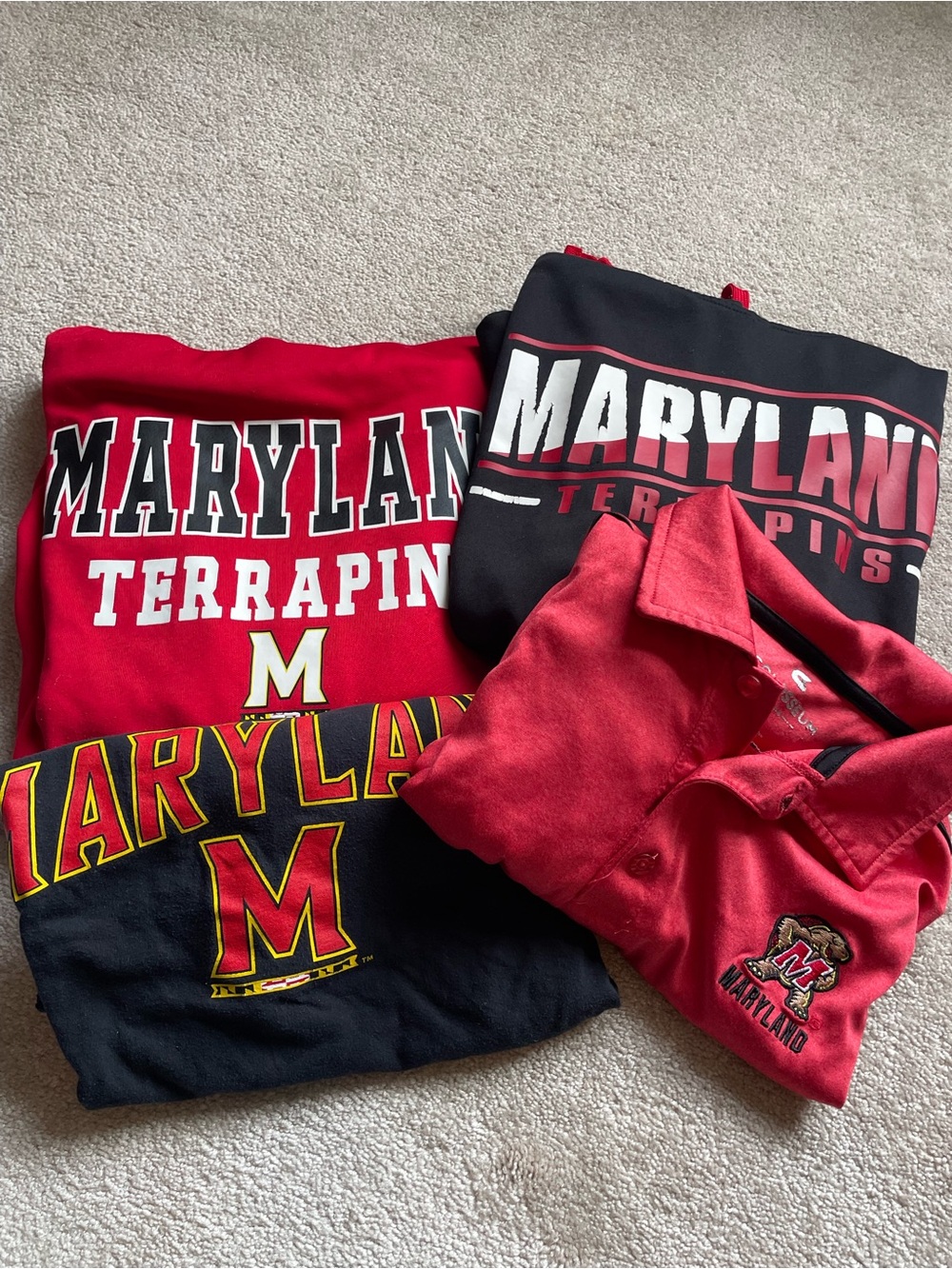 Men’s bundle of Maryland Terrapins sweatshirts, polo and t-shirt.